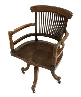 Lot 10 - A revolving desk chair