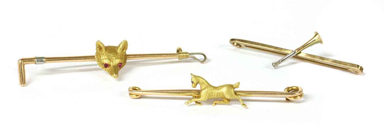 Lot 36 - A group of gold equestrian brooches