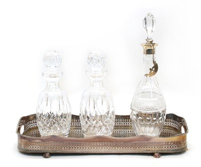 Lot 204 - A cut glass decanter with silver collar