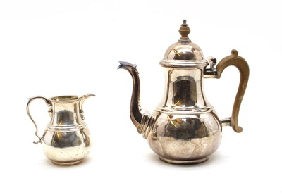 Lot 313 - A modern Britannia standard silver Coffee pot and cream jug (2)