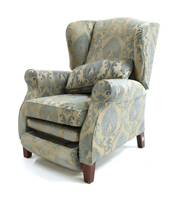 Lot 653 - A modern wing back armchair