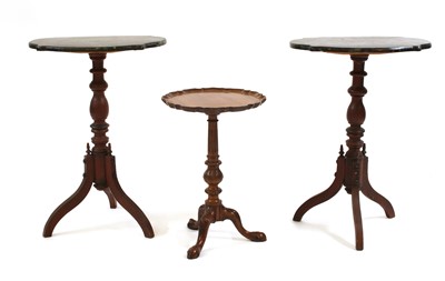 Lot 675 - A pair of Victorian grained pine tripod tables