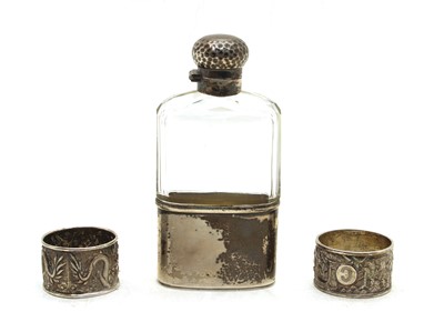 Lot 202A - An Edwardian cut-glass and silver-mounted hip flask