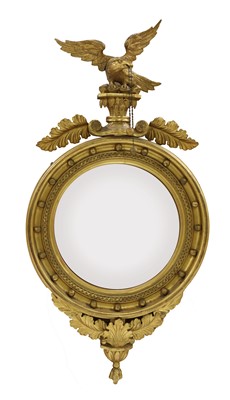 Lot 398 - A Regency-style carved giltwood convex wall mirror