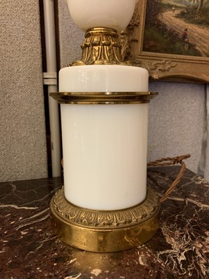 Lot 103 - A pair of opaline glass and gilt metal table lamps