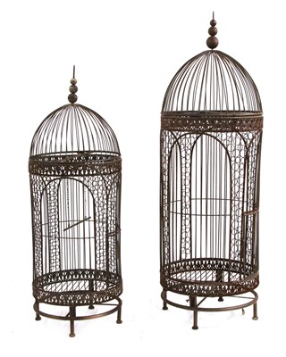 Lot 551 - A 19th century/ early 20th century wrought iron birdcage of domed form