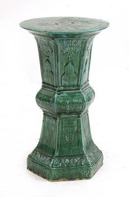Lot 518 - A Victorian green and turquoise glazed earthenware jardiniere stand