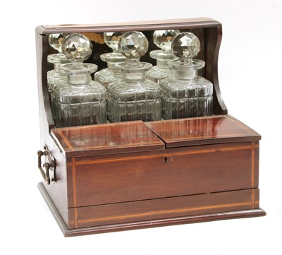 Lot 145L - A mahogany and inlaid tantalus-cum-cigar box