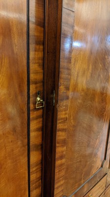 Lot 89 - A Regency mahogany, crossbanded and strung breakfront triple wardrobe