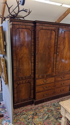 Lot 89 - A Regency mahogany, crossbanded and strung breakfront triple wardrobe