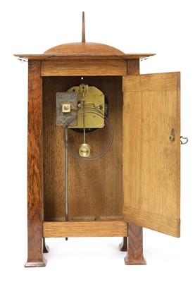 Lot 198 - A rare Arts and Crafts oak architectural clock, designed by CFA Voysey, c. 1902