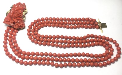 Lot 46 - An Italian gold three row uniform coral bead necklace