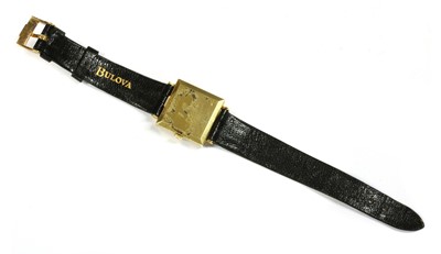 Lot 165 - A mid-size 18ct gold Bulova mechanical strap watch