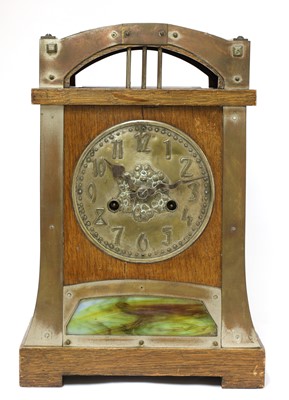 Lot 54 - A Secessionist oak and brass-mounted mantel clock