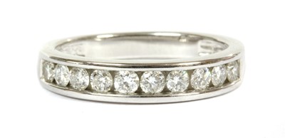 Lot 93 - A white gold diamond half eternity ring