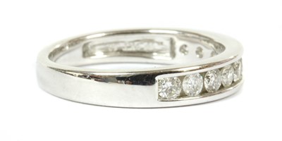 Lot 93 - A white gold diamond half eternity ring