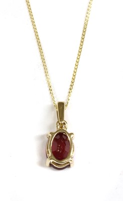 Lot 65 - A gold single stone ruby pendant