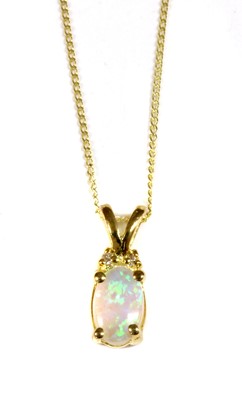 Lot 124 - A gold opal and diamond pendant