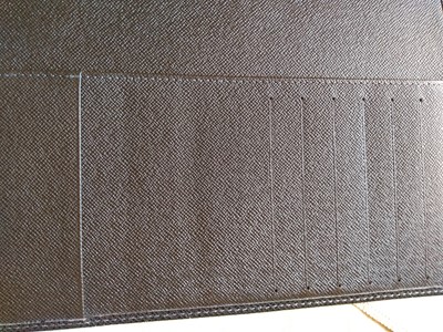 Lot 142 - A Louis Vuitton brown taiga leather desk agenda cover