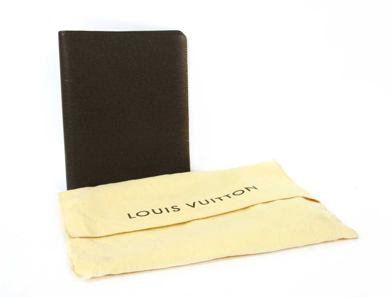 Lot 142 - A Louis Vuitton brown taiga leather desk agenda cover