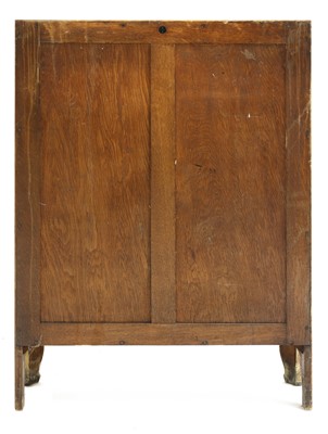 Lot 134 - An Arts and Crafts oak glazed bookcase