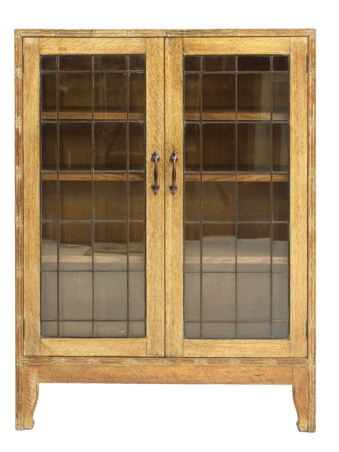 Lot 134 - An Arts and Crafts oak glazed bookcase
