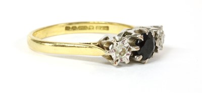 Lot 199 - An 18ct gold three stone sapphire and diamond ring