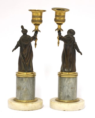 Lot 852 - A pair of French gilt and patinated bronze figural 'gout en turc' candlesticks