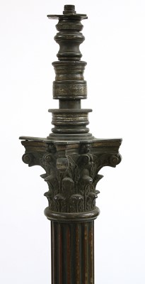 Lot 881 - A near pair of brass Corinthian column standard lamps