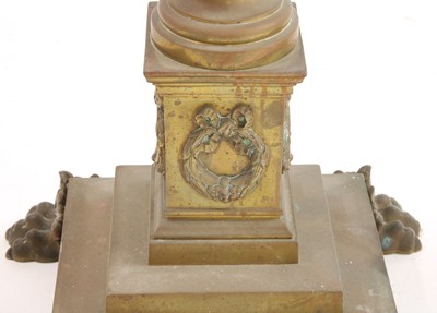 Lot 881 - A near pair of brass Corinthian column standard lamps