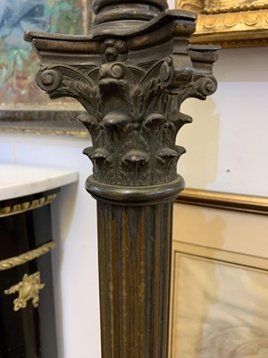 Lot 881 - A near pair of brass Corinthian column standard lamps