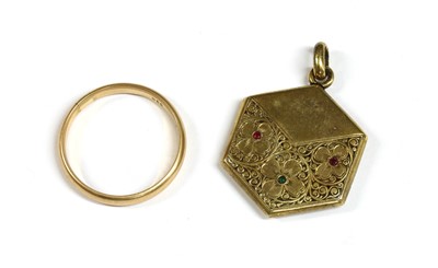 Lot 194 - A gold hexagonal ruby and emerald set locket
