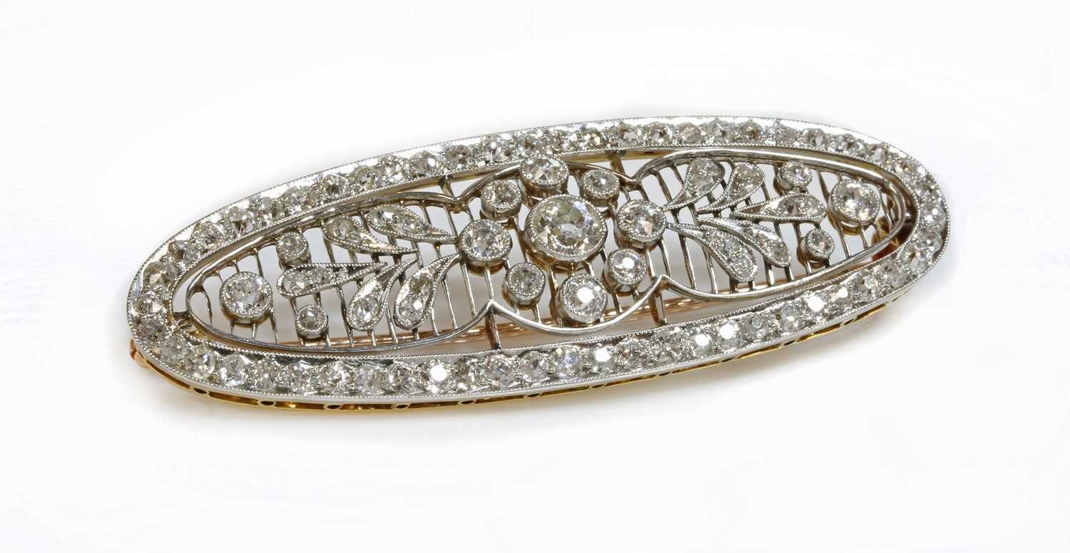 Lot 152 - A Belle Époque diamond set oval plaque brooch