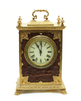 Lot 163 - A German brass and embossed leather mantel clock
