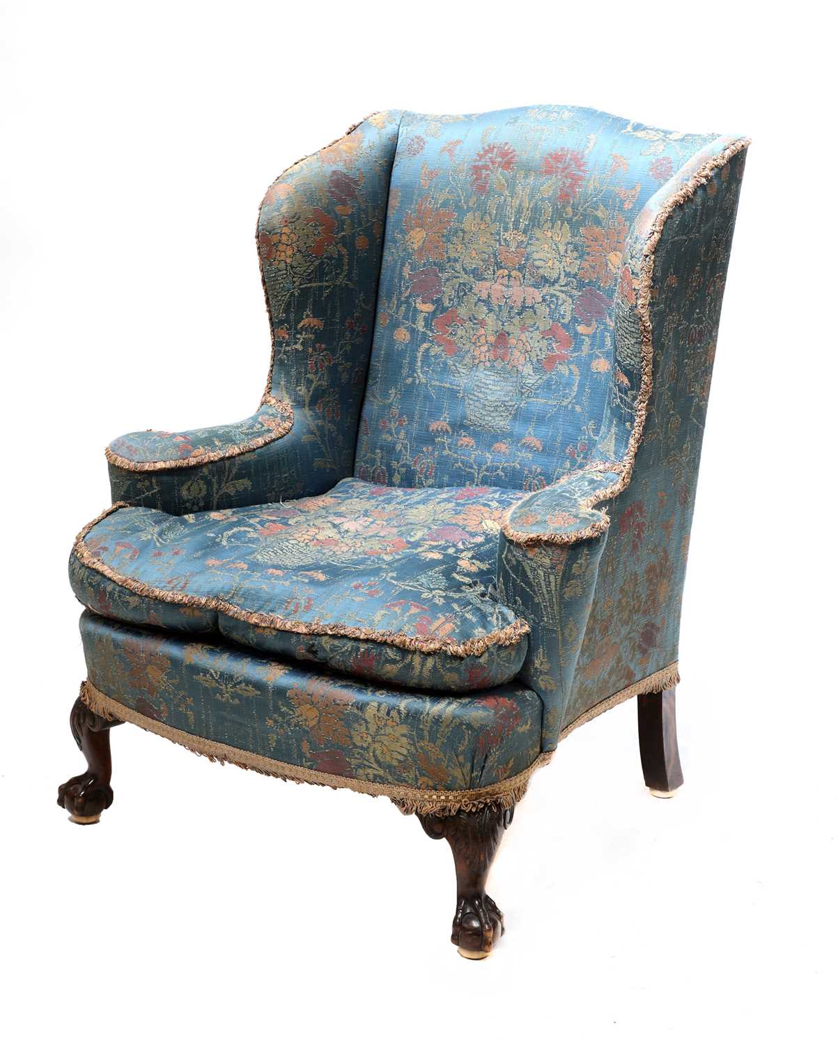 Lot 47 - A silk upholstered wingback armchair