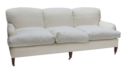 Lot 64 - A pair of three seater sofas