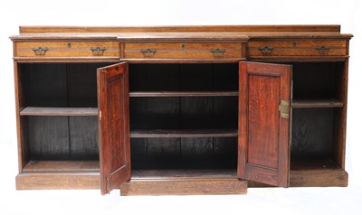 Lot 114 - A large late Victorian oak breakfront bookcase