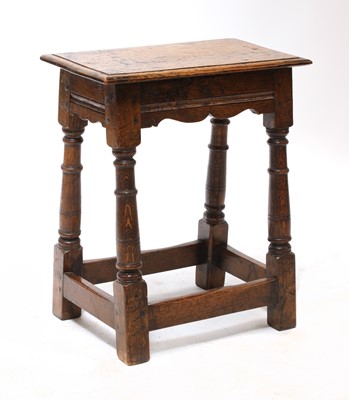 Lot 124 - An oak joint stool