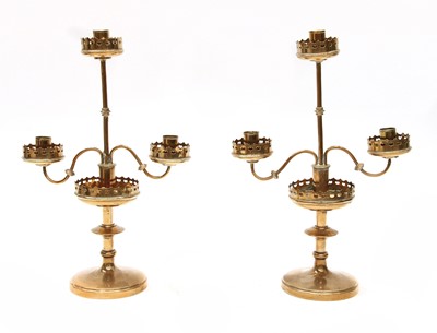 Lot 145I - A pair of gothic brass three-light candelabra