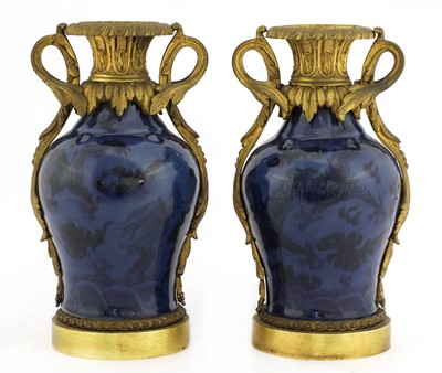 Lot 383 - A pair of gilt-bronze mounted Chinese porcelain cassolettes