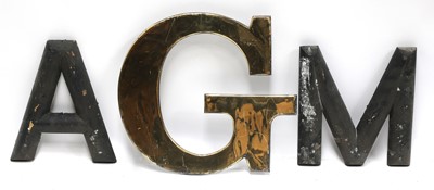 Lot 807 - A brass letter 'G' and a quantity of wooden letters