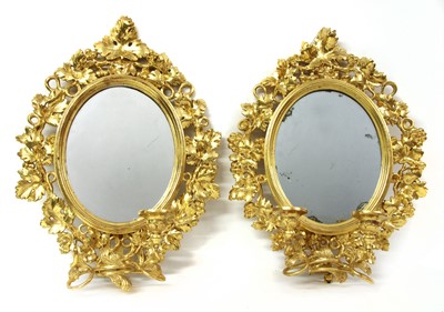 Lot 203 - A pair of George III style carved giltwood girandoles