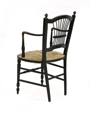 Lot 72 - A Morris & Co. ebonised elbow chair