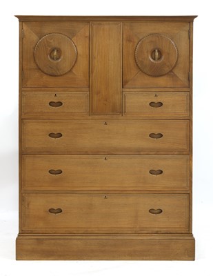 Lot 262 - A chestnut 'owl' cabinet