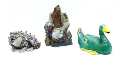 Lot 153 - A Chinese pottery figure
