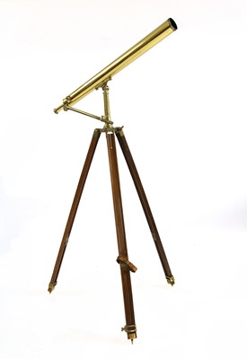 Lot 554 - A brass telescope on tripod stand