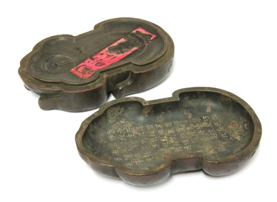 Lot 242 - A Chinese stoneware inkstone and cover