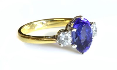 Lot 355 - An 18ct gold three stone tanzanite and diamond ring