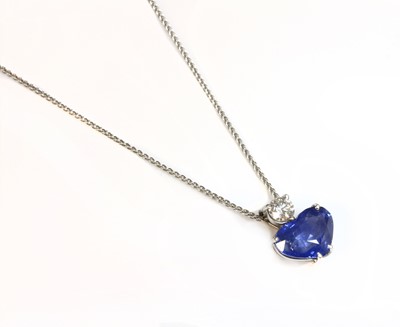 Lot 273 - A white gold sapphire and diamond heart-shaped pendant