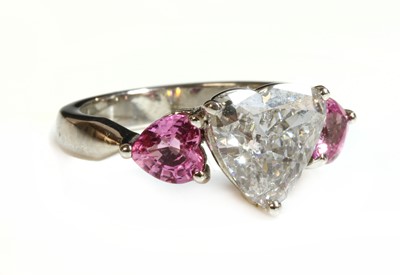 Lot 324 - A platinum diamond and pink sapphire three stone ring